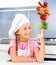 Little girl balanced pyramid of vegetables