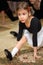 Little girl in ballet class sits on string