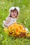 Little girl with a basket with sunflowers