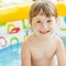 Little girl bathes in yellow Inflatable Swimming Paddling Pool o