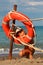 Little girl in bathing suit standing on beach