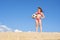 Little girl on the beach plays with a soccer ball. Sports, recreation, vacations. Family outdoor sports games