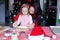 Little girl with beautiful mother baking Christmas