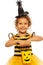 Little girl in bee costume with Halloween bucket