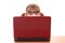 Little girl behind laptop