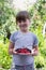 Little girl with berries in hands