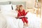 Little girl with Bible praying in bedroom