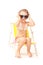 Little girl in big sunglasses sitting on deckchair