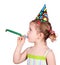 Little girl with birthday hat and trumpet party