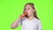 Little girl bites a carrot, it is healthy. Green screen. Slow motion