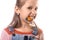 Little girl biting orthodontic appliance on white background