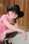 Little girl in black western hat