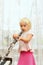 A little girl blows the clarinet and closes the chord switching holes with her fingers