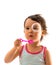 Little girl blows soap bubbles over white
