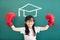 little girl with boxing gloves and graduation concept