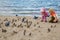 Little girl and boy play beach in autumn day