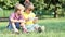 Little girl and boy play with tablet