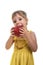 Little girl in a bright yellow dress with maracas in her hands. Studio photo, bright white background.