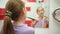 Little girl brushing her teeth in the bathroom