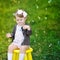 Little girl with bubble blower in a park