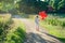 Little girl with a bunch of red balloons