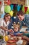 A Little Girl Celebrates with Her Loving Parents as Candles Illuminate the Cake