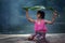 The little girl cheerful playing raining