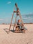 Little girl chilling resting in beach chair Happy child smiling relaxing enjoying life sun fresh air. Autumn travel