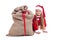 Little girl in christmas outfit hiding behind santa bag