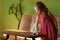 Little girl cleans dust cloth on table