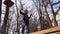 Little girl climb to the rope Park.