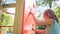 Little girl on climbing wall on playground