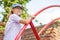 Little girl climbs up a ladder in a playground