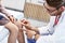 Little girl in clinic having a checkup with dermatologist