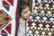 Little girl close up portrait in kilims with traditional folk geometric patterns