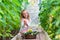 Little girl collecting crop cucumbers and tomatos in greenhouse. Time to harvest.