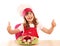 Little girl cook with thumbs up and decorated salad