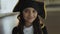 Little girl in costume of pirate posing at camera
