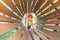 A little girl crawls along a wooden tunnel