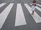 Little girl crossing street