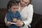 The little girl is crying and doesn`t want to give the injection. Mom persuades her daughter to take an insulin injection.