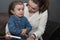 The little girl is crying and doesn`t want to give the injection. Mom persuades her daughter to take an insulin injection.