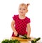 Little girl cut vegetables