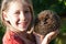 Little girl with cute hedgehog