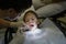 Little girl at dentist office, dentist applying antiseptic for dental treatment