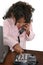 Little Girl Dialing Phone At Desk