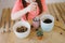 Little girl digs up the ground for rosetting with a spoon