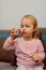 little girl doing bubbles in the livingroom, One year old