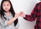 Little girl doing Pinky Swear with her sister