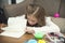 Little girl drawing a colorful pictures using pencil crayons